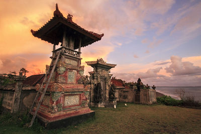 Low angle view of temple against sky during sunset