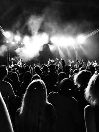 People enjoying music concert at night