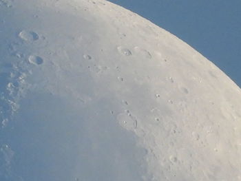 Low angle view of snow covered landscape against sky