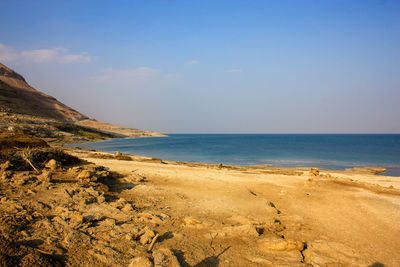 Scenic view of beach and sea against sky