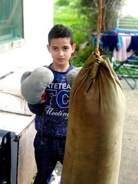 Portrait of boy holding outdoors