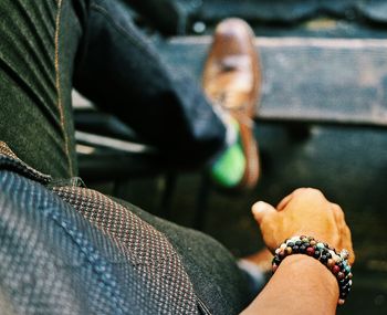 Woman sitting with hands