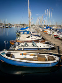 Boats moored at harbor