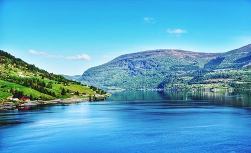 Scenic view of lake against blue sky