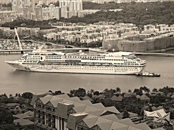 Boats in harbor with buildings in background