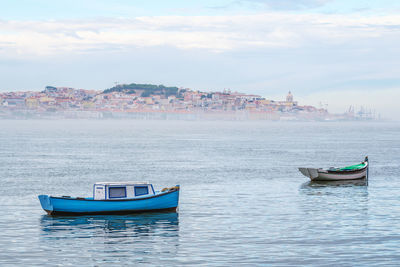 Boat in sea against sky