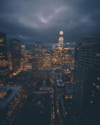 High angle view of illuminated buildings against sky at dusk