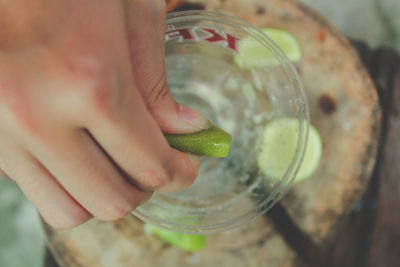 Close-up of hand holding drink