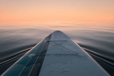 Paddleboard at sea. view from the board. sunset time.