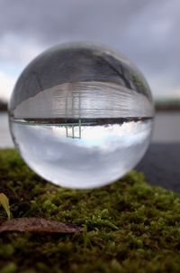 Close-up of crystal ball on field