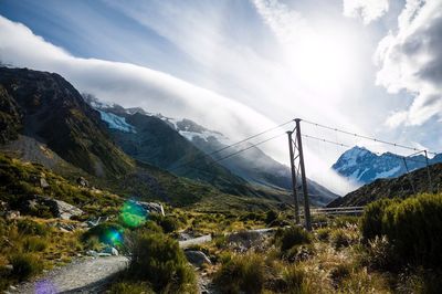 Scenic view of mountains against cloudy sky