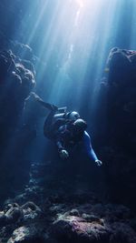 Scuba diver diving undersea