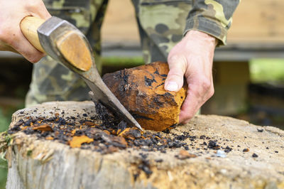 Close-up of man preparing food