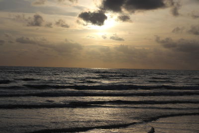 Scenic view of sea against sky at sunset