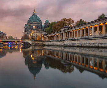 Berlin cathedral against cloudy sky during sunset