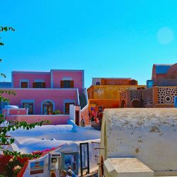 Buildings against clear blue sky