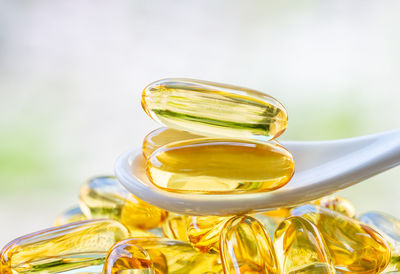 Close-up of fish oil on a white spoon