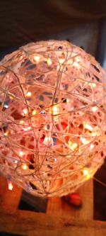 Close-up of illuminated christmas lights on table