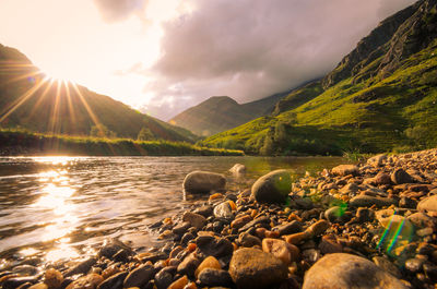 A lake in the scottish highlands during the sunset