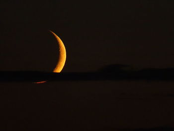 Scenic view of moon against sky at night