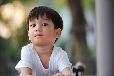 Portrait of cute boy looking away