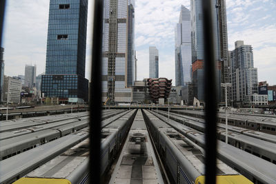 Trains against buildings in cityscape