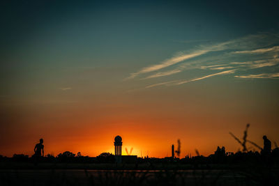 Silhouette of buildings at sunset