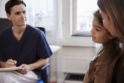 Mother and daughter having doctor appointment