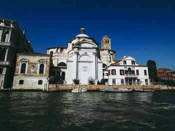 View of buildings against blue sky