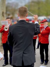 Rear view of people photographing