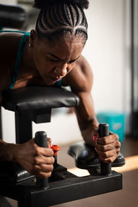 Man exercising with dumbbell in gym