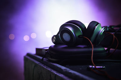 Close-up of headphones on table at nightclub