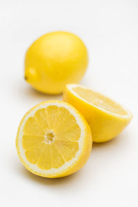 Close-up of lemon slice against white background