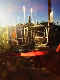 Close-up of illuminated lamp against sky at night