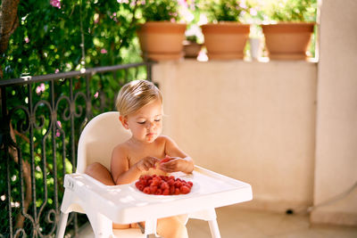 Woman sitting on table