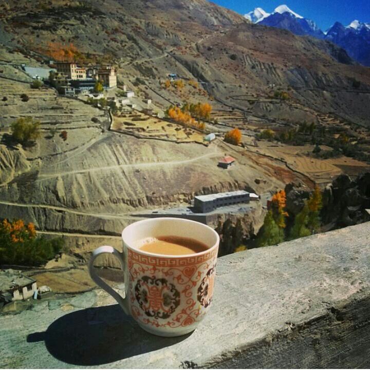 drink, food and drink, refreshment, coffee cup, mountain, table, coffee - drink, high angle view, freshness, saucer, day, coffee, mountain range, tranquility, outdoors, frothy drink, sunlight, landscape, no people, cup