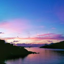 Scenic view of lake at sunset