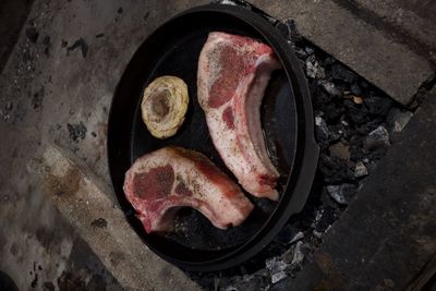 High angle view of meat on barbecue grill