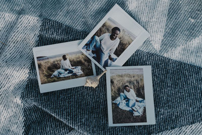 High angle view of woman photographing on table