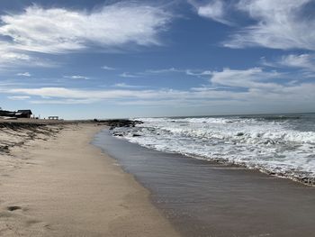 Scenic view of beach against sky