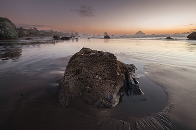 Southern oregon coast sunset with rock in foreground, bandon oregon.