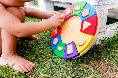 High angle view of child playing with ball