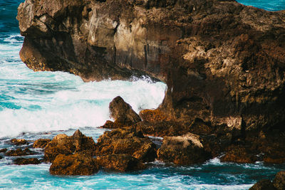 Aerial view of rock formation on sea shore