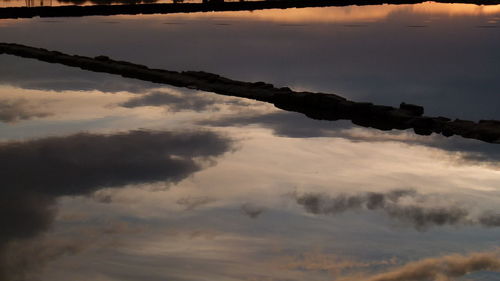 Scenic view of clouds in sky at sunset