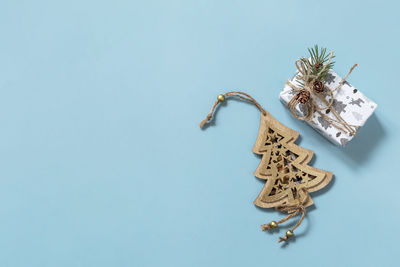 High angle view of decoration on table against blue background