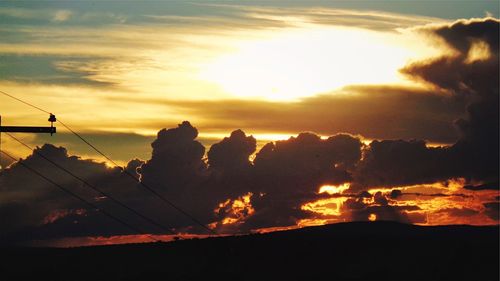 Low angle view of silhouette trees against sky during sunset