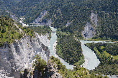 Aerial view of river passing through mountains