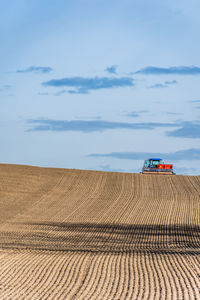 Farmer sowing with tractor