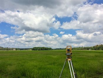 Scenic view of farm against sky