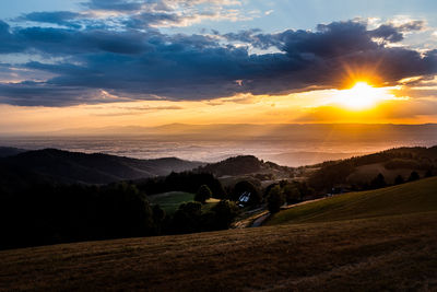 Scenic view of landscape against sky during sunset